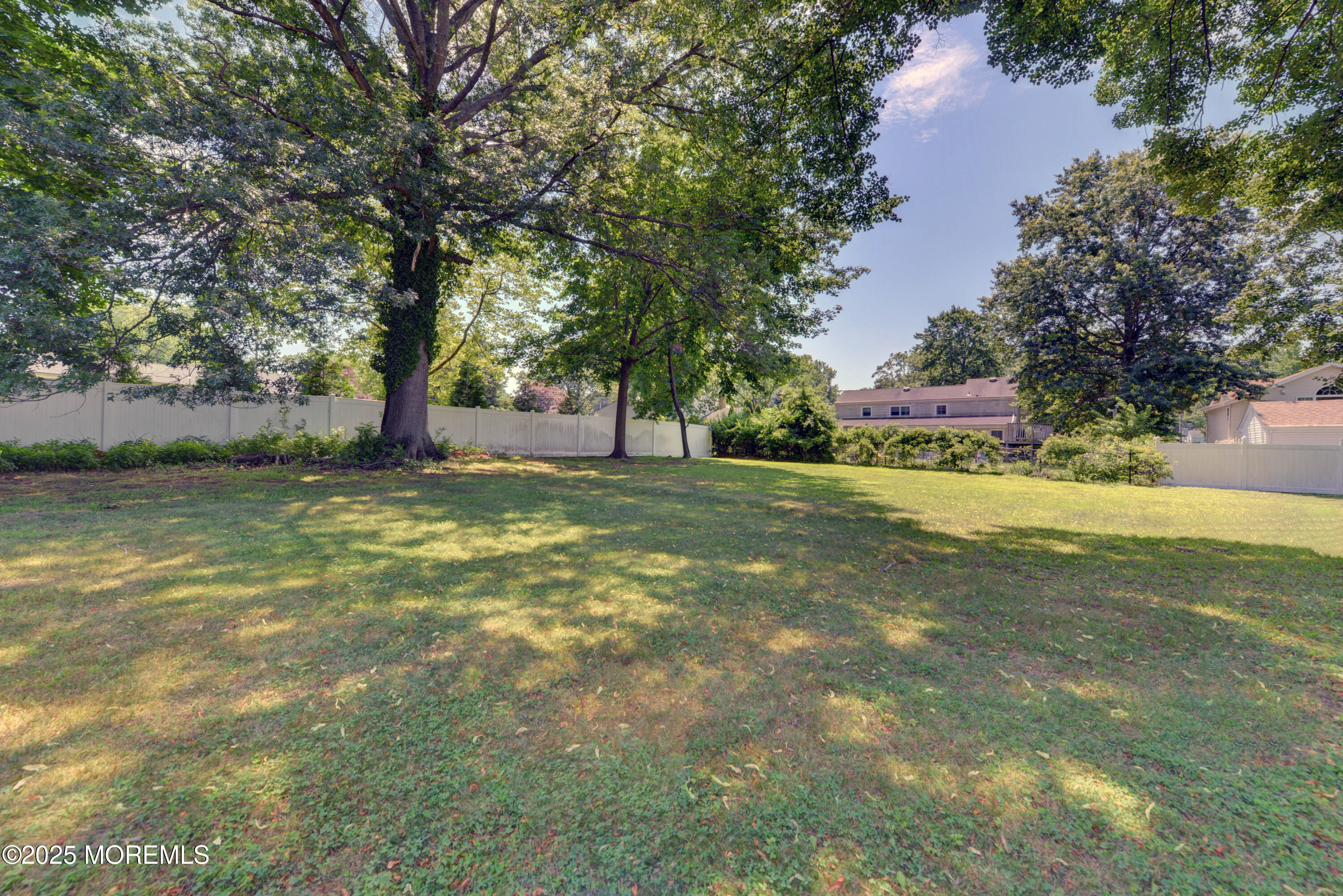 26 Old Manor Road Holmdel, NJ 07733 - Photo 34 of 37 a view of a yard with a tree