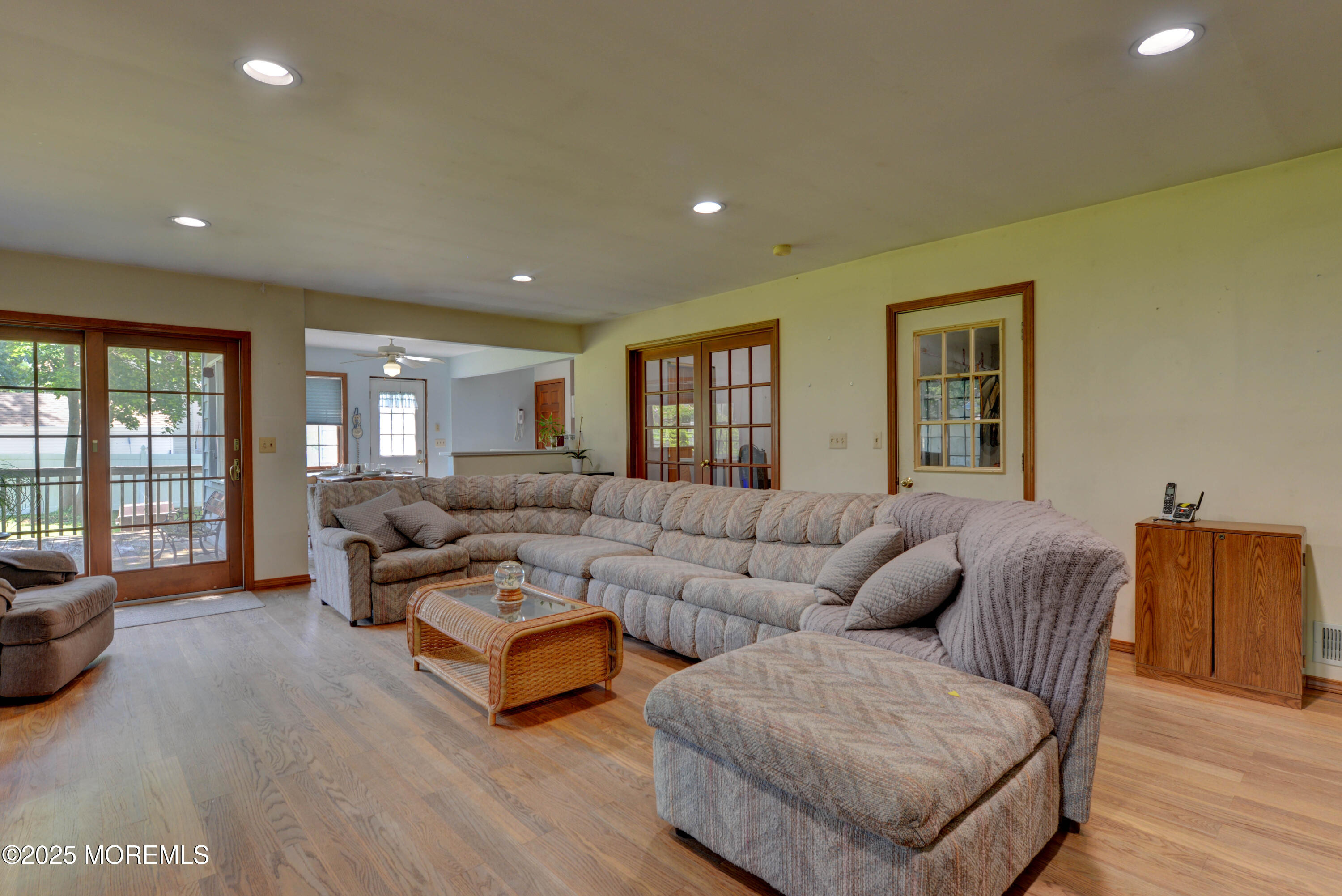 26 Old Manor Road Holmdel, NJ 07733 - Photo 8 of 37 a living room with furniture and a wooden floor