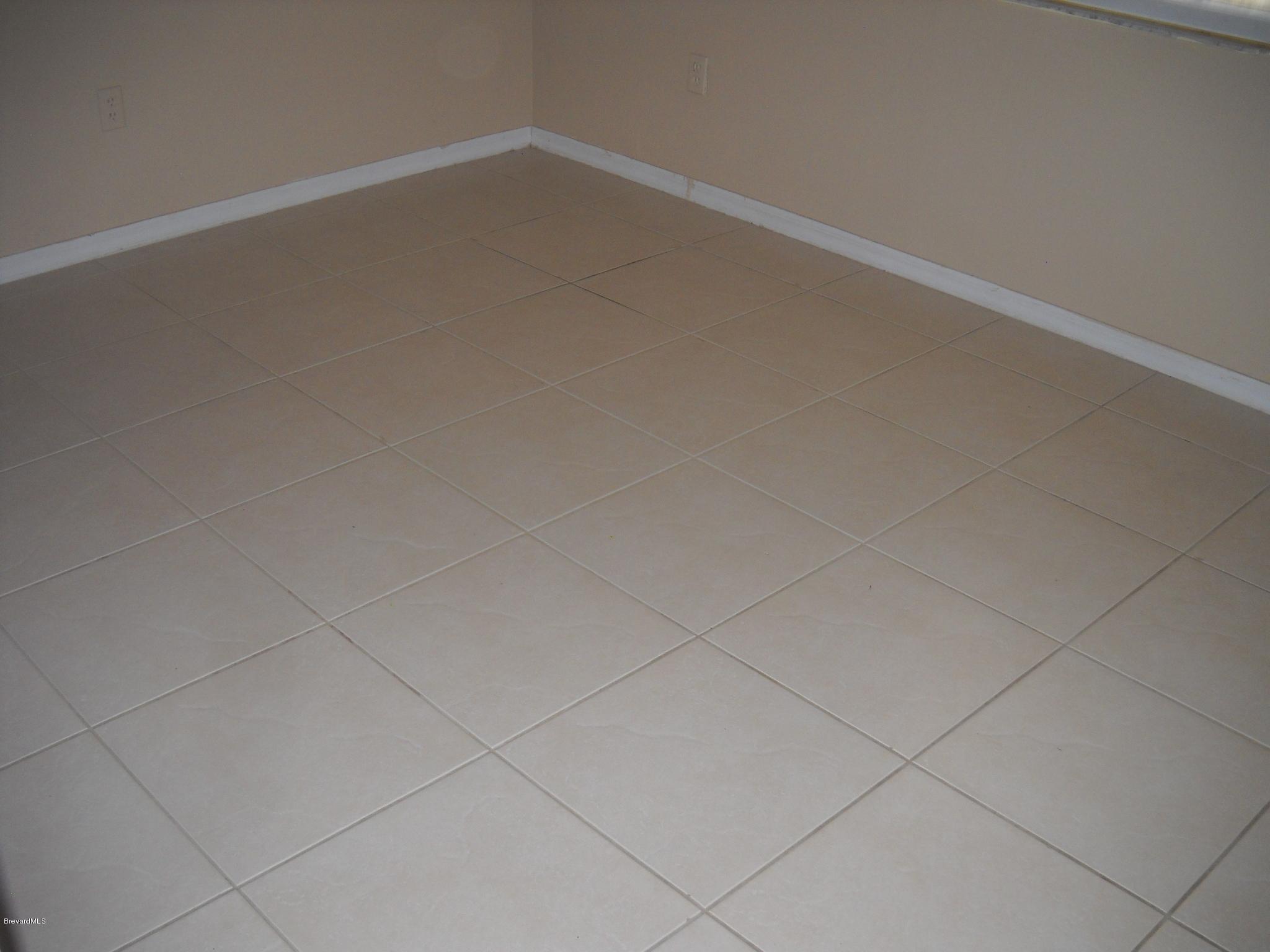 6468 Hudson Road Cocoa, FL 32927 - Photo 14 of 18 2nd bedroom tile floors