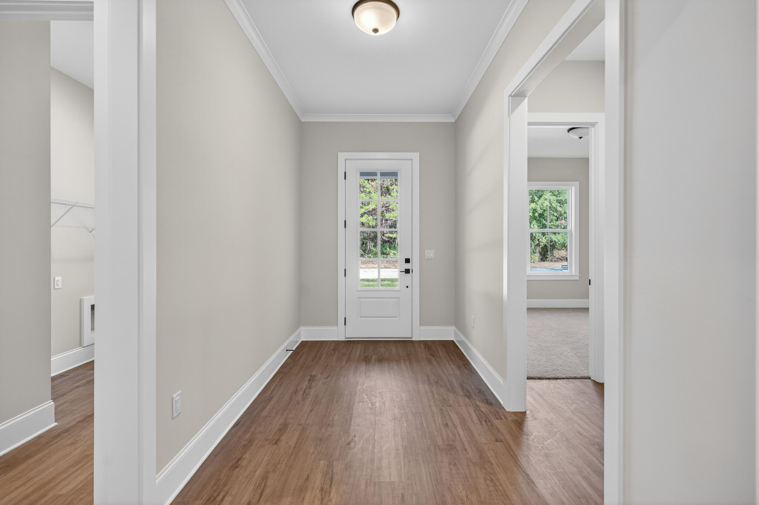 397 North J Hunter's Way, Unit LOT 36 Freeport, FL 32439 - Photo 11 of 54 a view of entryway with wooden floor