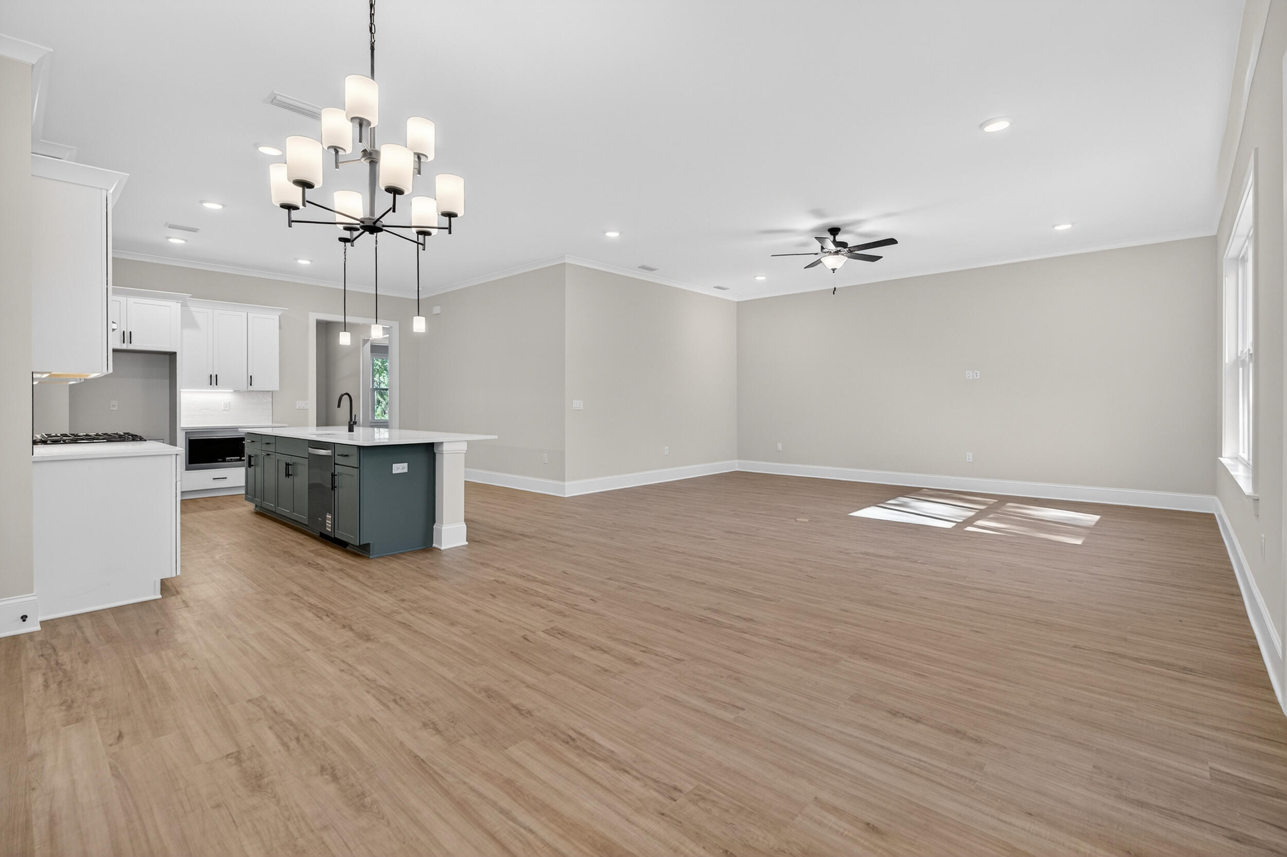 397 North J Hunter's Way, Unit LOT 36 Freeport, FL 32439 - Photo 26 of 54 a view of a room with wooden floor and kitchen