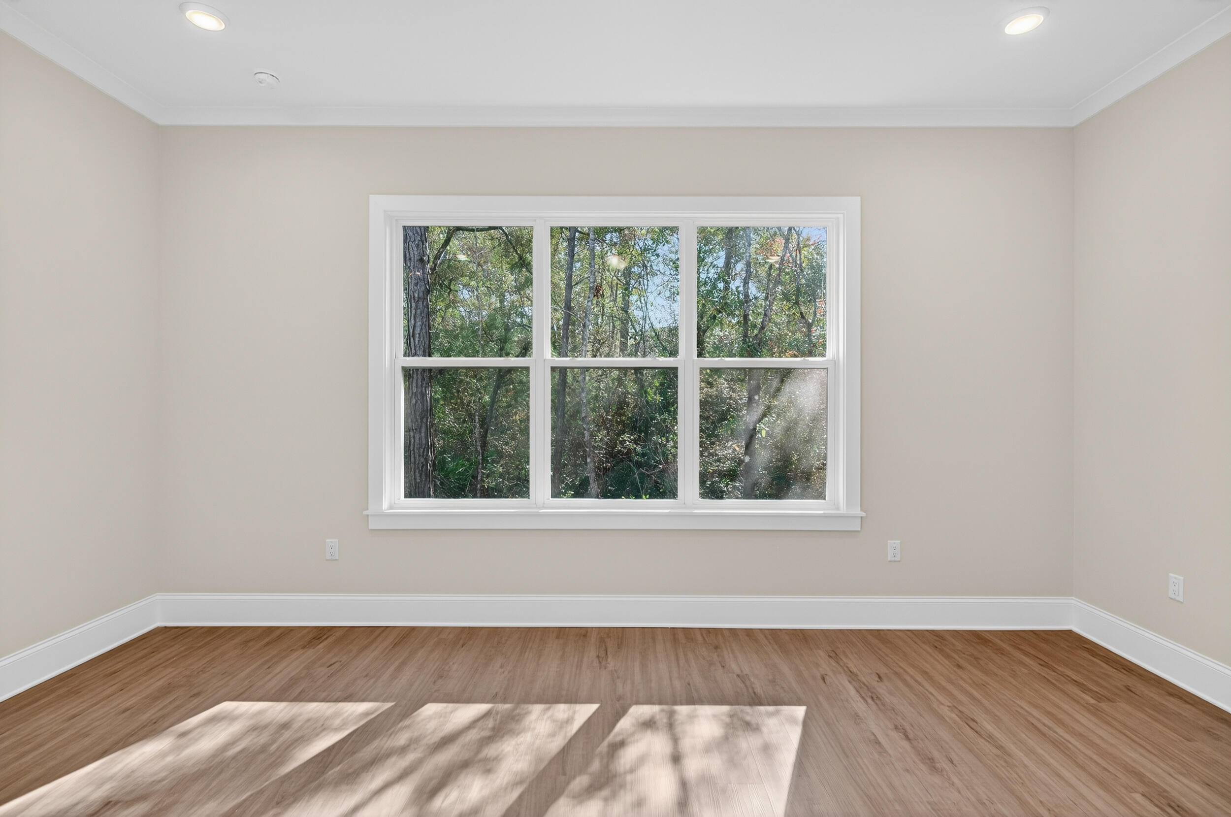 397 North J Hunter's Way, Unit LOT 36 Freeport, FL 32439 - Photo 28 of 54 a view of an empty room with wooden floor and a window