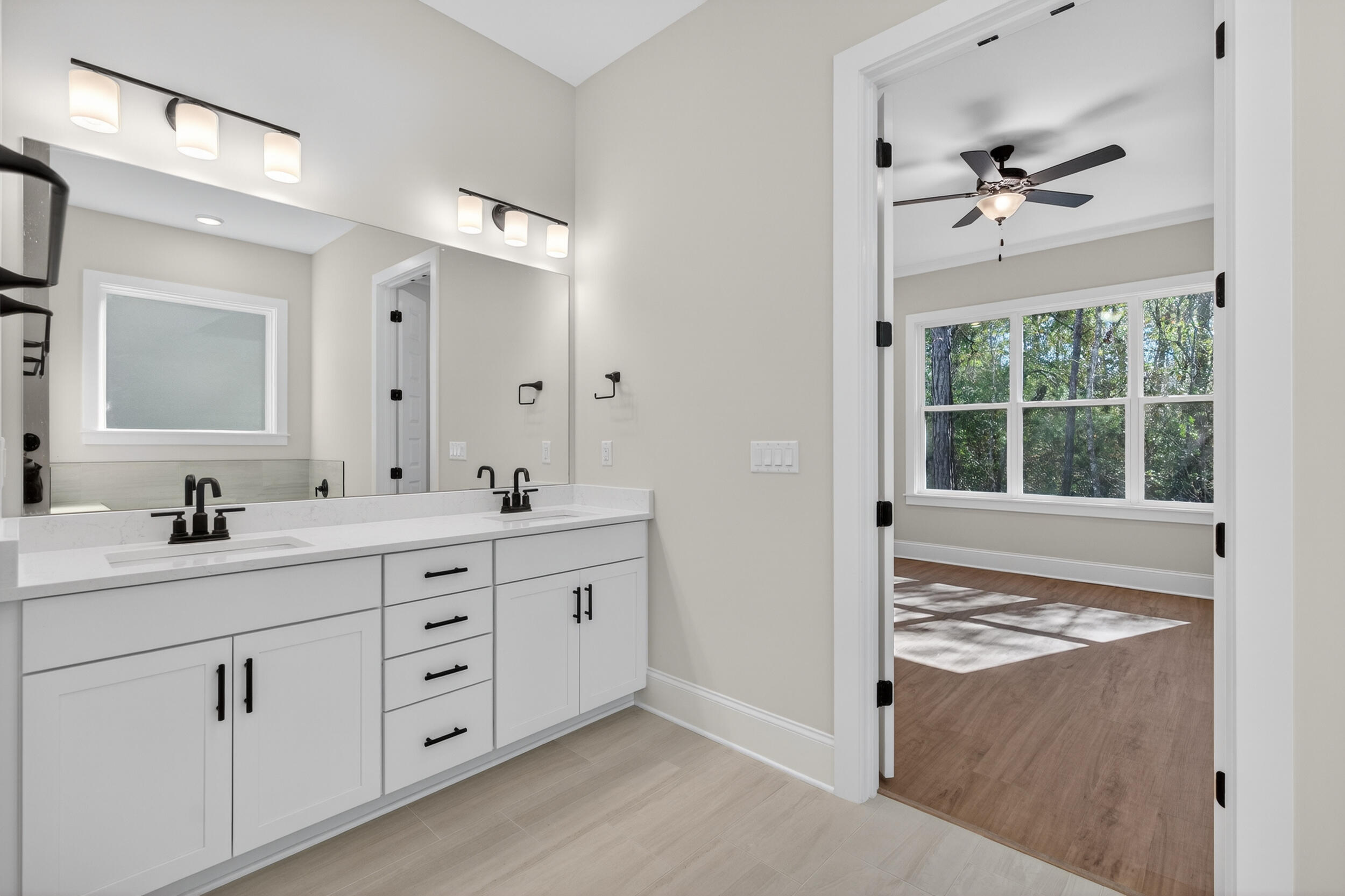 397 North J Hunter's Way, Unit LOT 36 Freeport, FL 32439 - Photo 32 of 54 a bathroom with a sink double vanity and a mirror