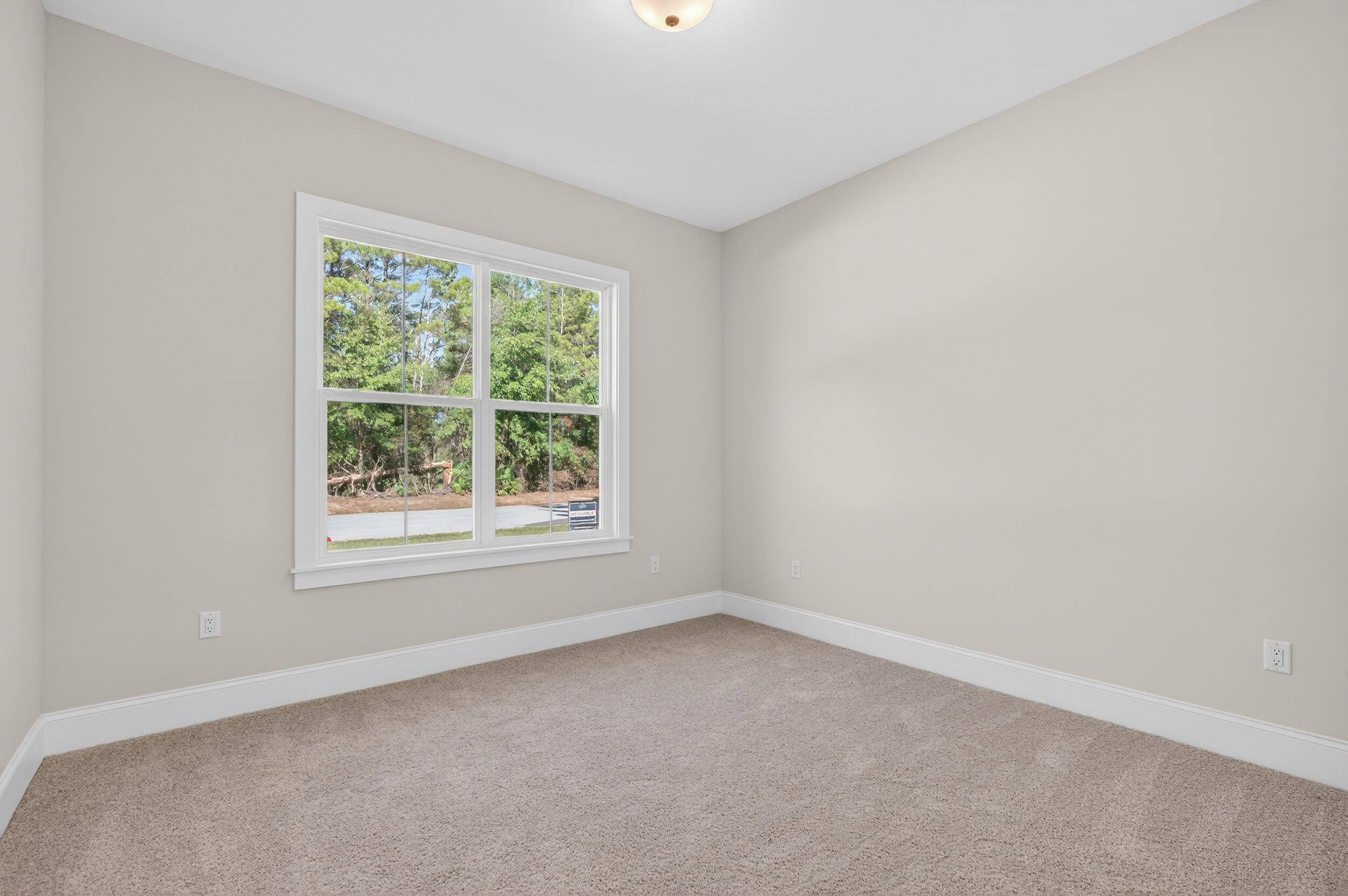 397 North J Hunter's Way, Unit LOT 36 Freeport, FL 32439 - Photo 33 of 54 an empty room with a window