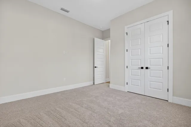 an aerial view of a houses with a yard