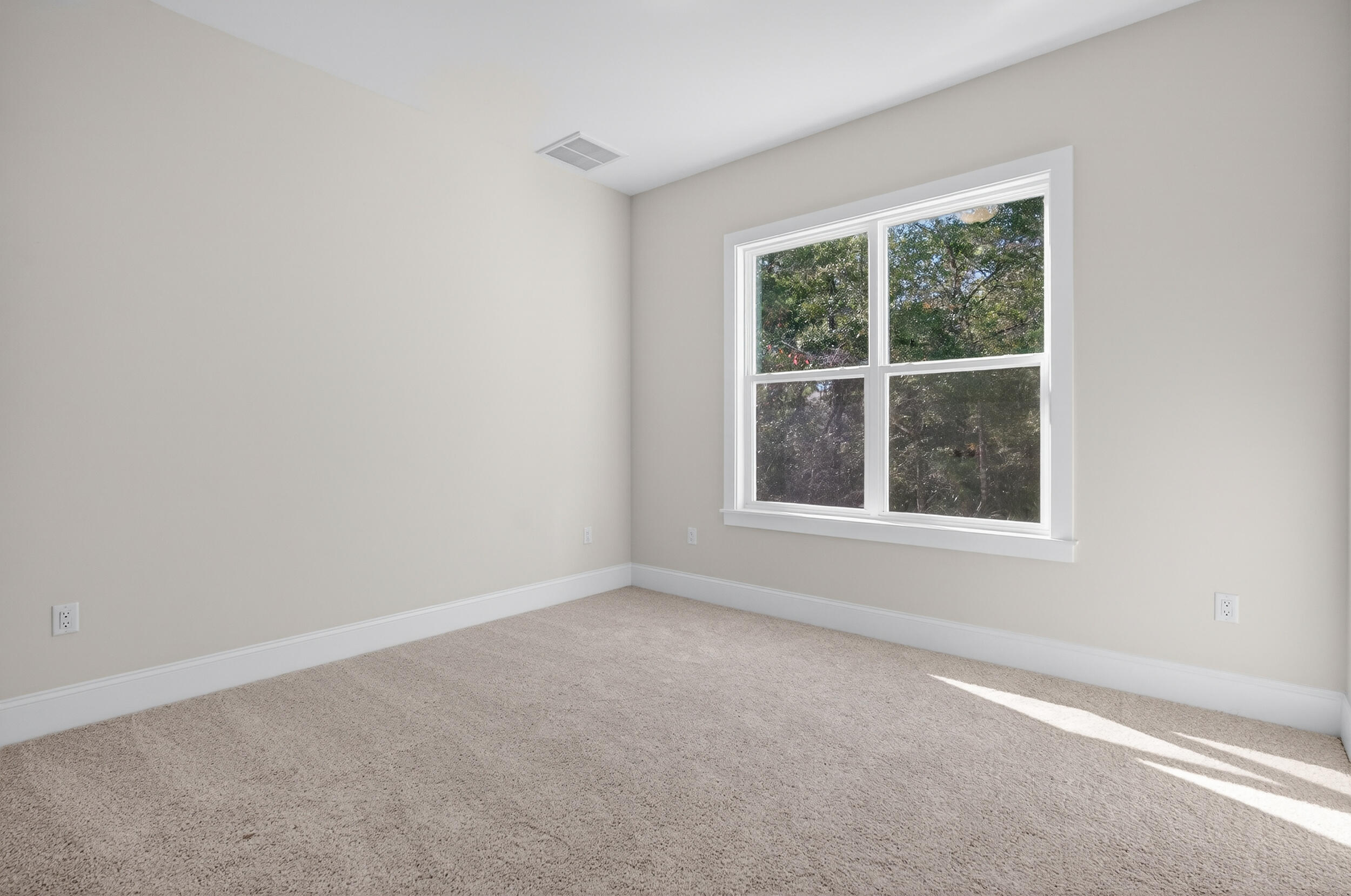 397 North J Hunter's Way, Unit LOT 36 Freeport, FL 32439 - Photo 38 of 54 an empty room with a window