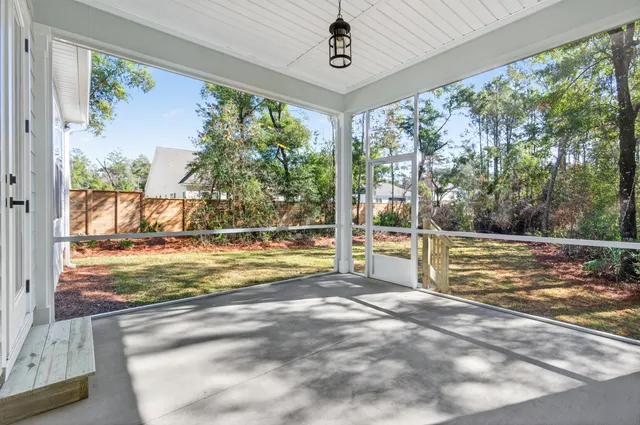 a view of hallway with wooden floor