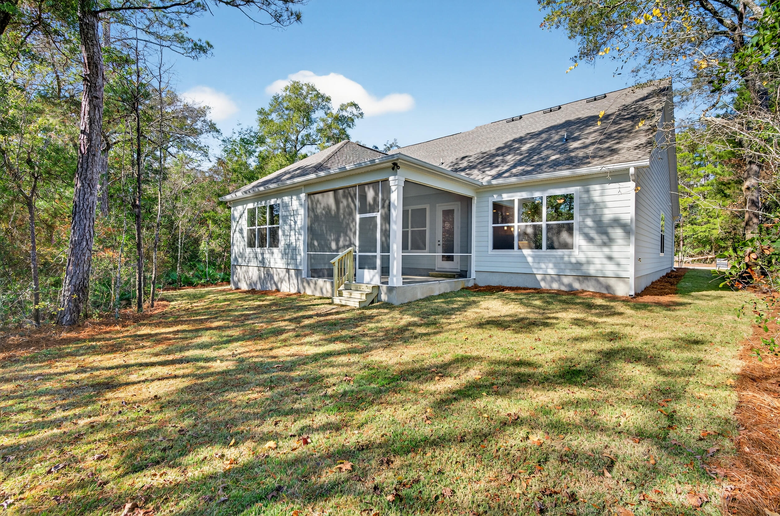 397 North J Hunter's Way, Unit LOT 36 Freeport, FL 32439 - Photo 7 of 54 a view of a house with backyard and sitting area