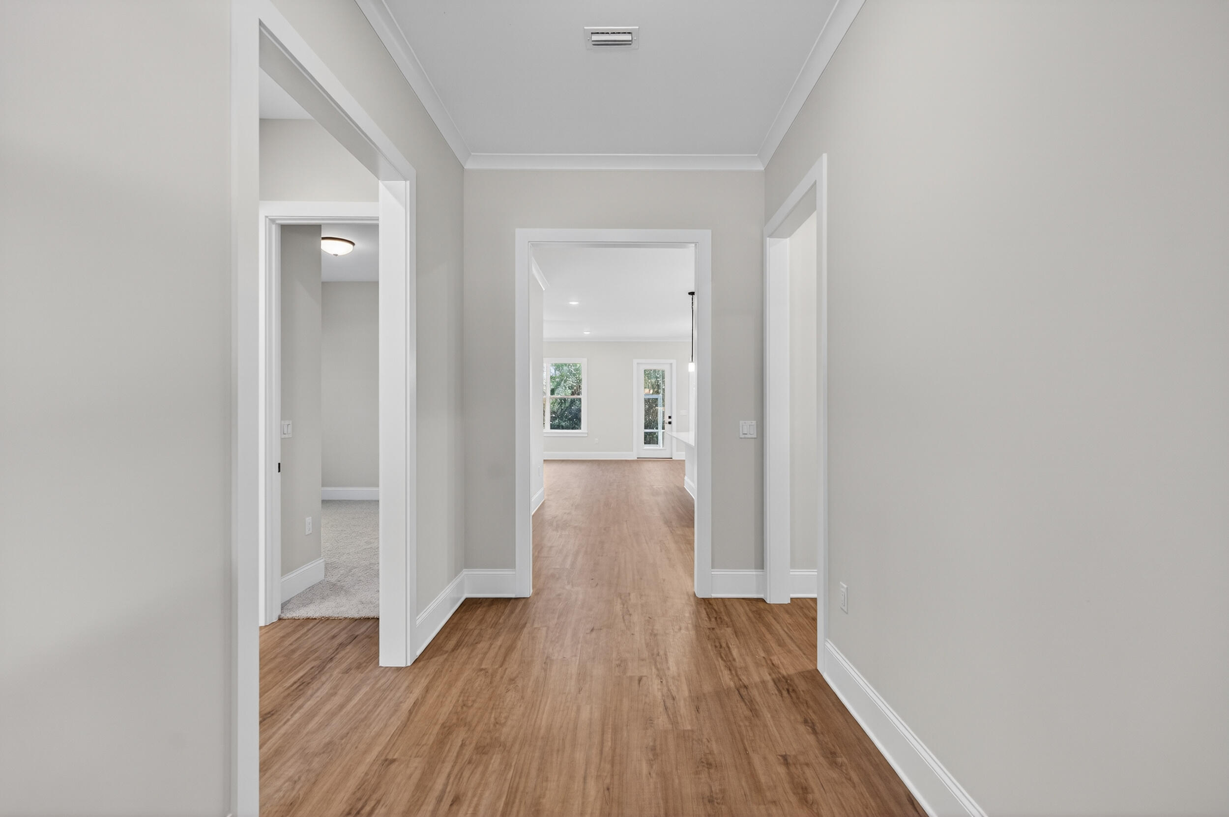 397 North J Hunter's Way, Unit LOT 36 Freeport, FL 32439 - Photo 9 of 54 a view of hallway with wooden floor