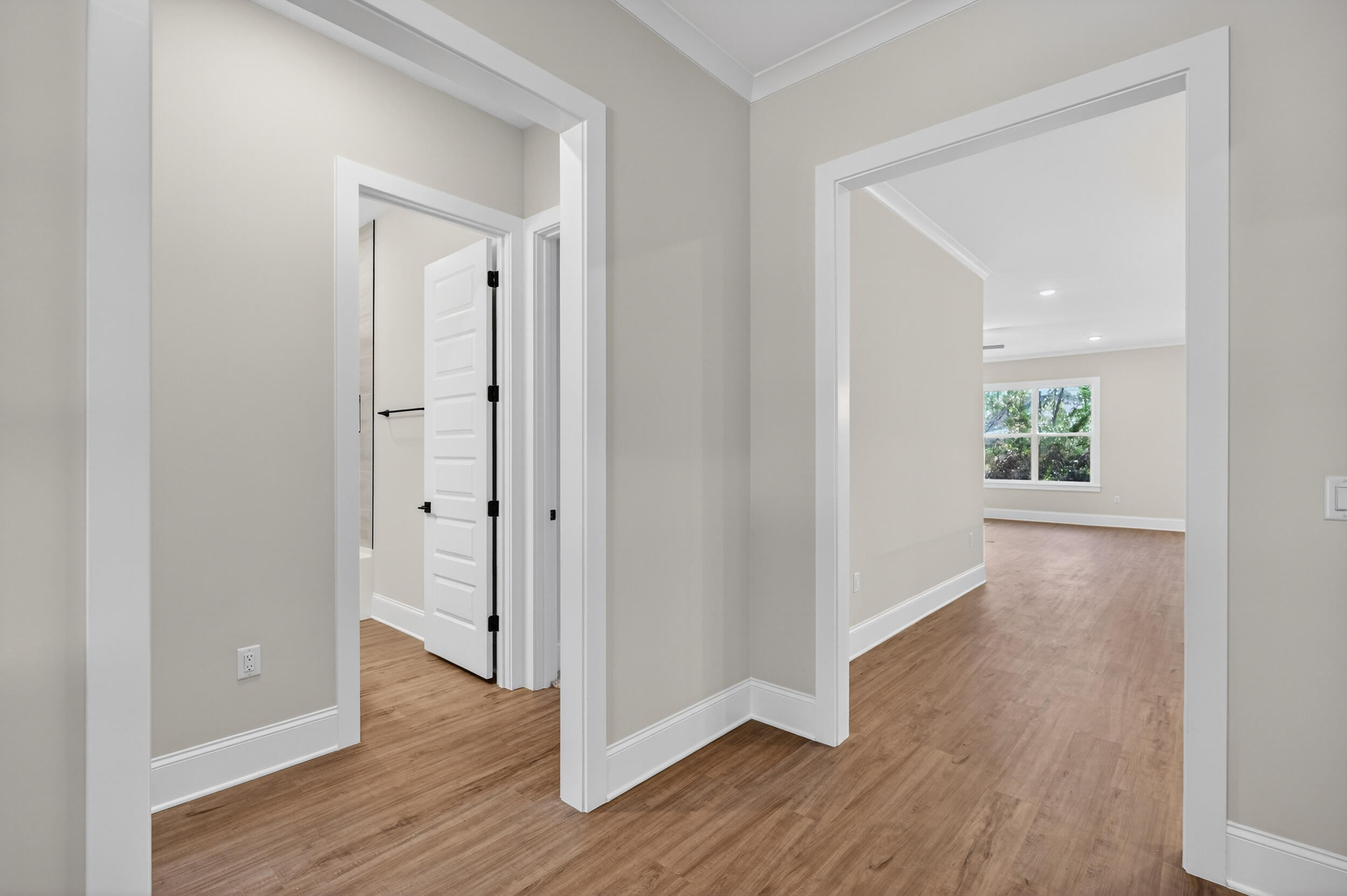 397 North J Hunter's Way, Unit LOT 36 Freeport, FL 32439 - Photo 10 of 54 a view of a hallway with wooden floor