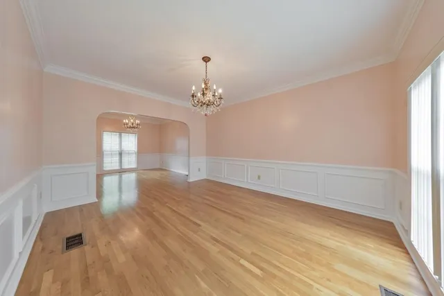 a kitchen with stainless steel appliances granite countertop a refrigerator sink and stove