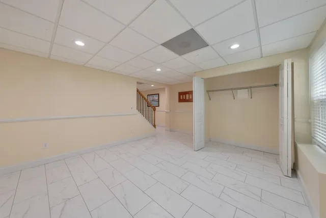 an aerial view of a house with a swimming pool