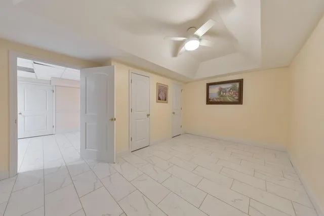 a picture of a room with a white wall and sign