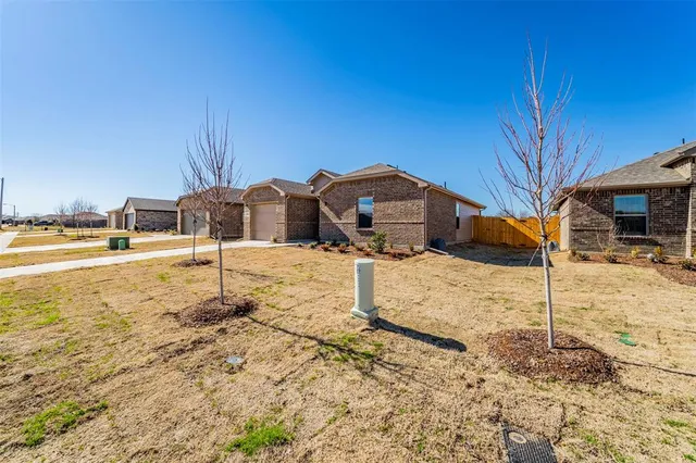 a view of a yard with a snow on the road
