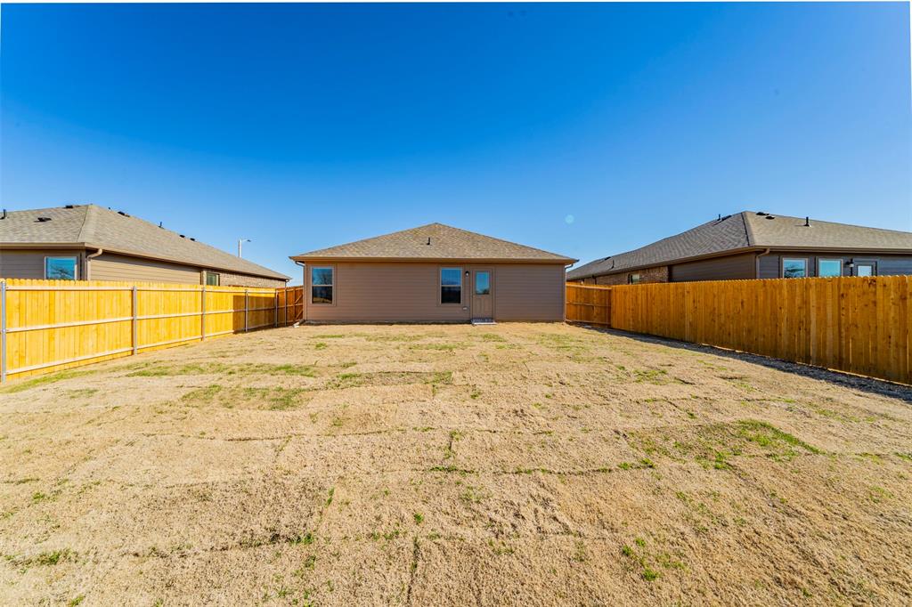 6406 Rienzi Drive Greenville, TX 75402 - Photo 23 of 26 a front view of a house with a yard