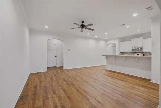 a view of a kitchen with a sink and cabinets