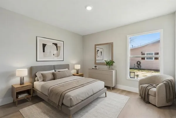 a kitchen with stainless steel appliances granite countertop white cabinets a stove a sink and dishwasher