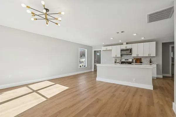 a view of a park with large trees