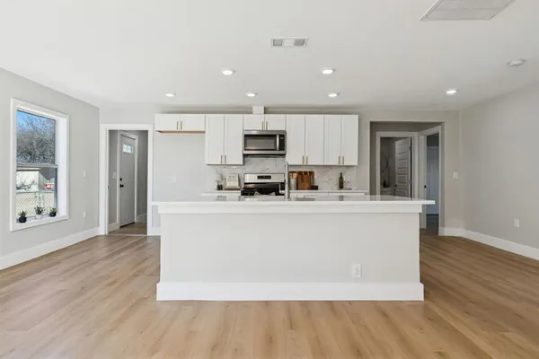 a view of an empty room with a window