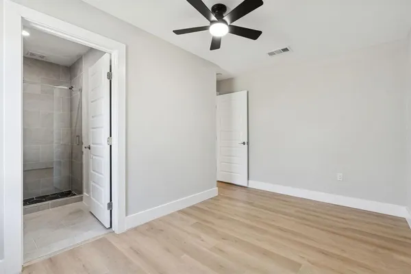 a kitchen with granite countertop a sink and dishwasher a stove top oven