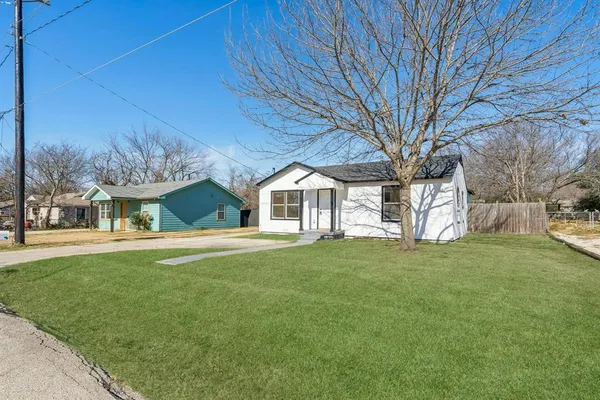 a view of an empty room and wooden floor