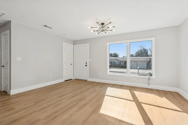 a view of an empty room with a window