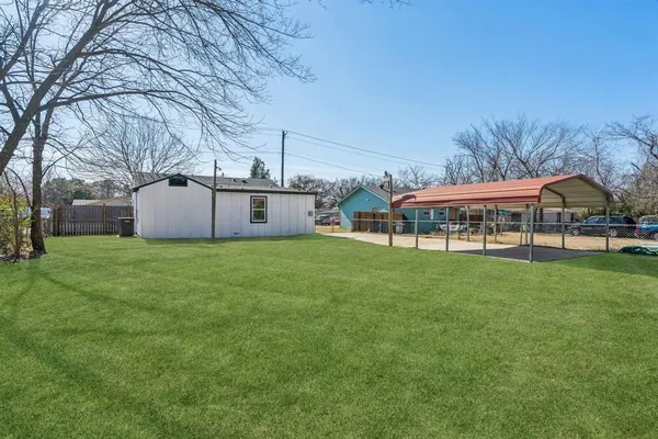 a front view of house with yard and seating area