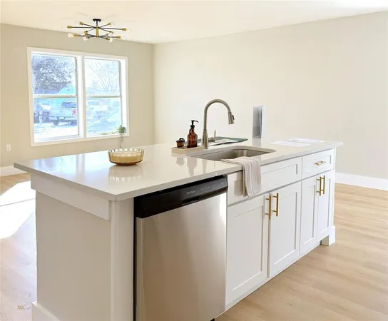 a view of kitchen with refrigerator and microwave