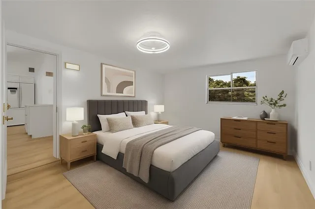 a bedroom with a bed and a dresser