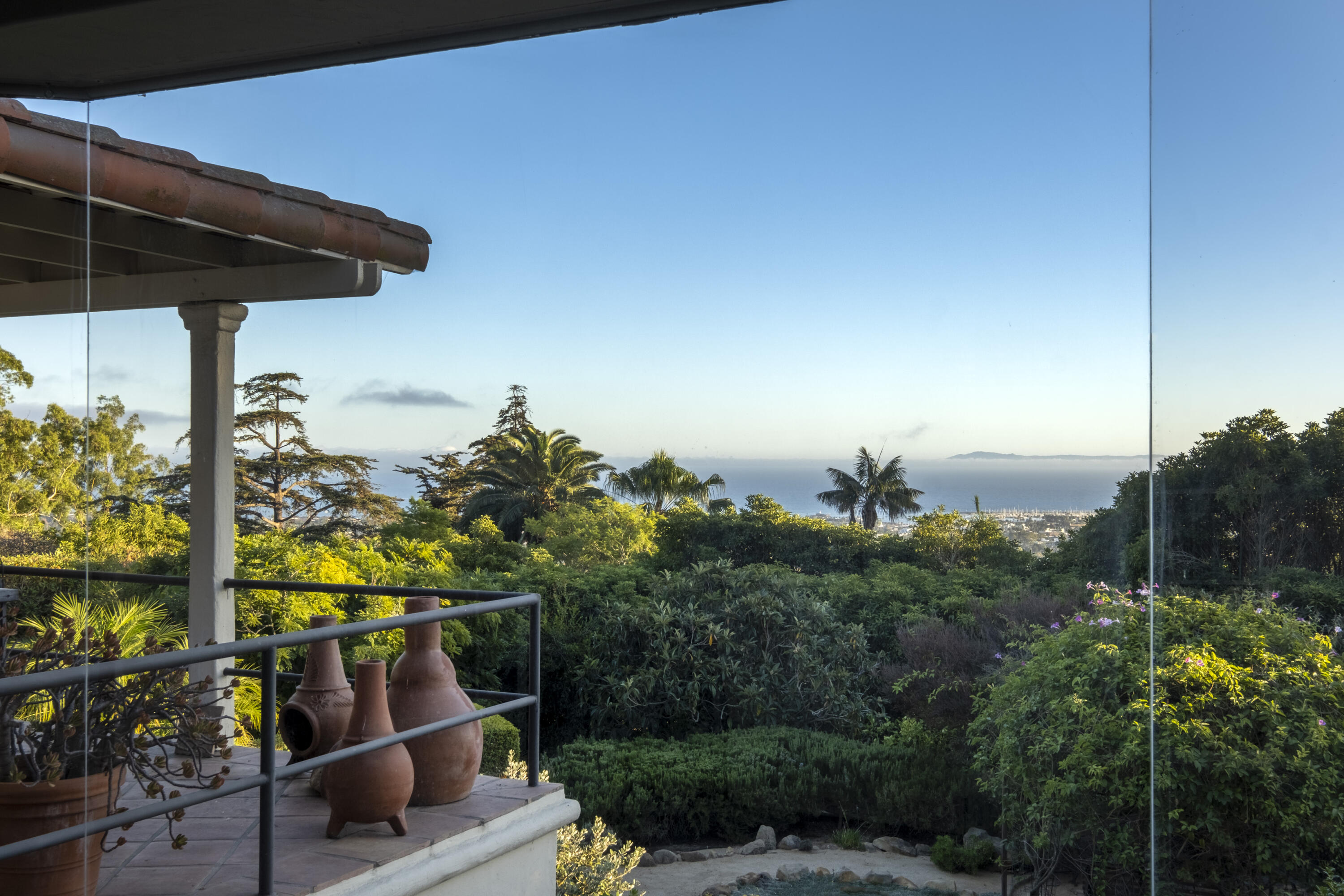 1611 Paterna Road Santa Barbara, CA 93103 - Photo 3 of 13 a view of a terrace with chairs and potted plants