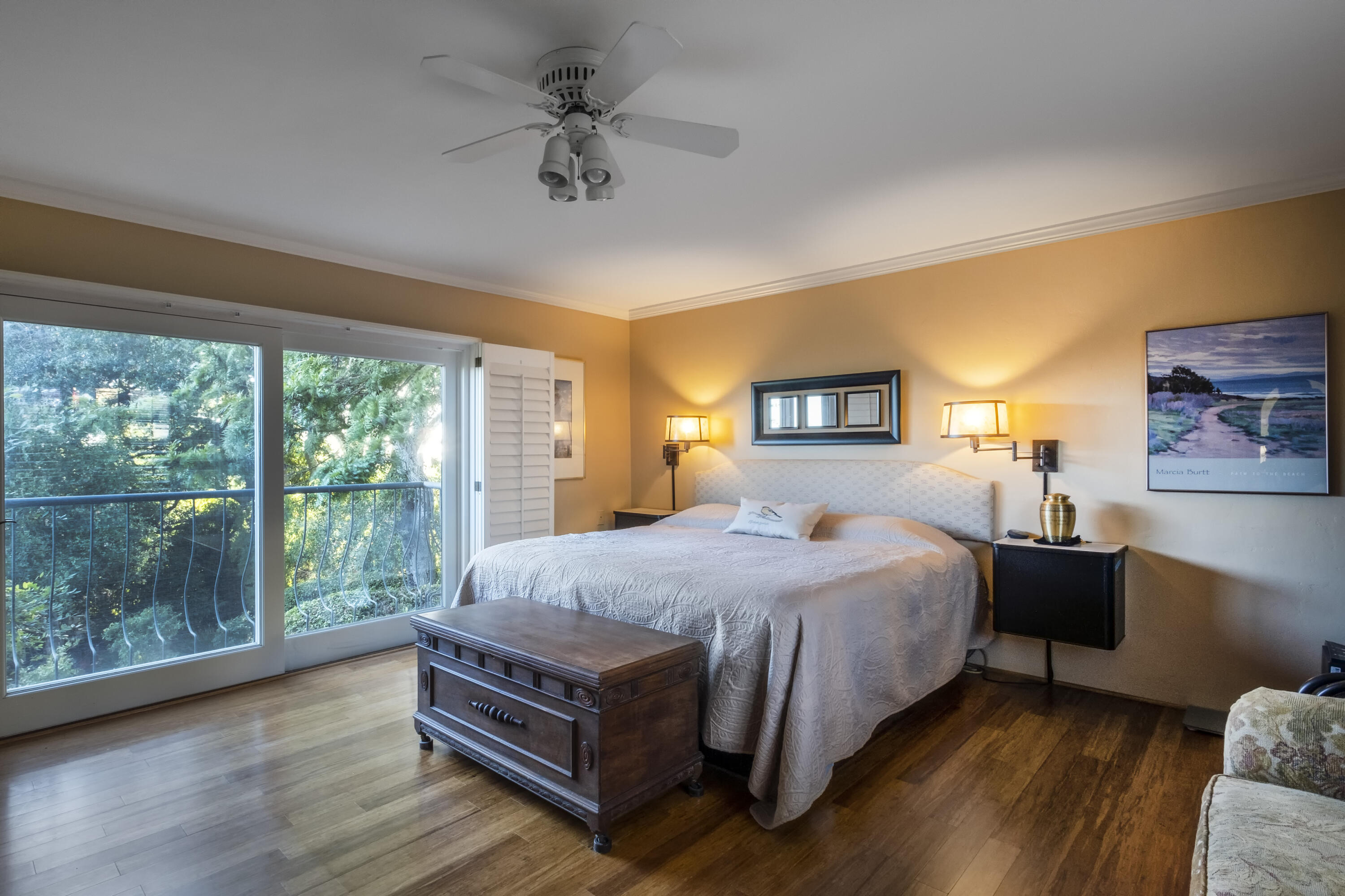 1611 Paterna Road Santa Barbara, CA 93103 - Photo 4 of 13 a bedroom with a bed and wooden floor