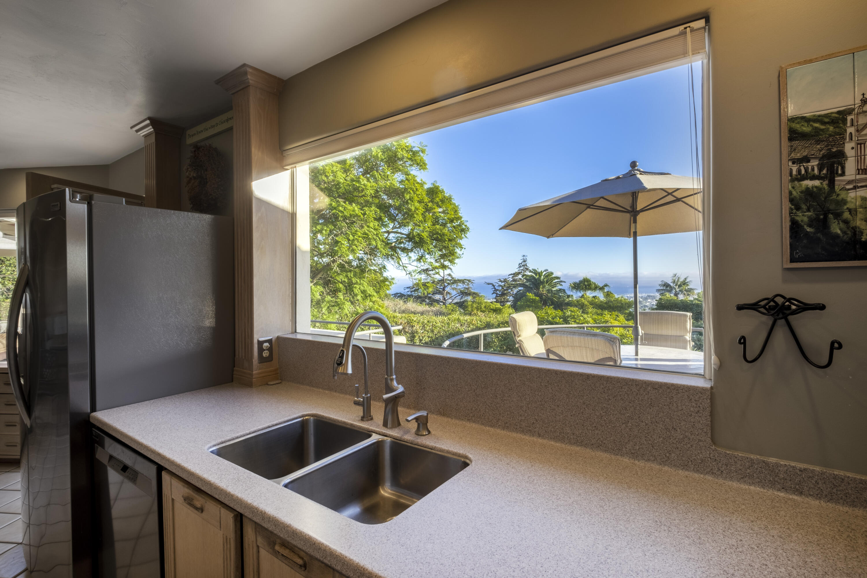 1611 Paterna Road Santa Barbara, CA 93103 - Photo 7 of 13 a kitchen that has a sink and a refrigerator