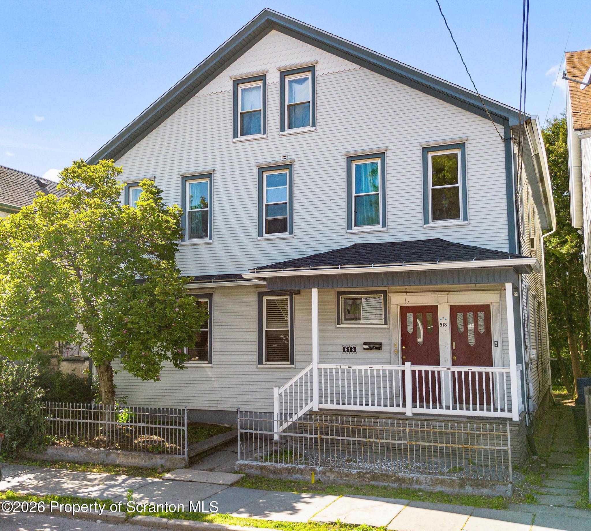 518 Prospect Avenue Scranton, PA 18505 - Photo 2 of 59 a front view of a house with a yard