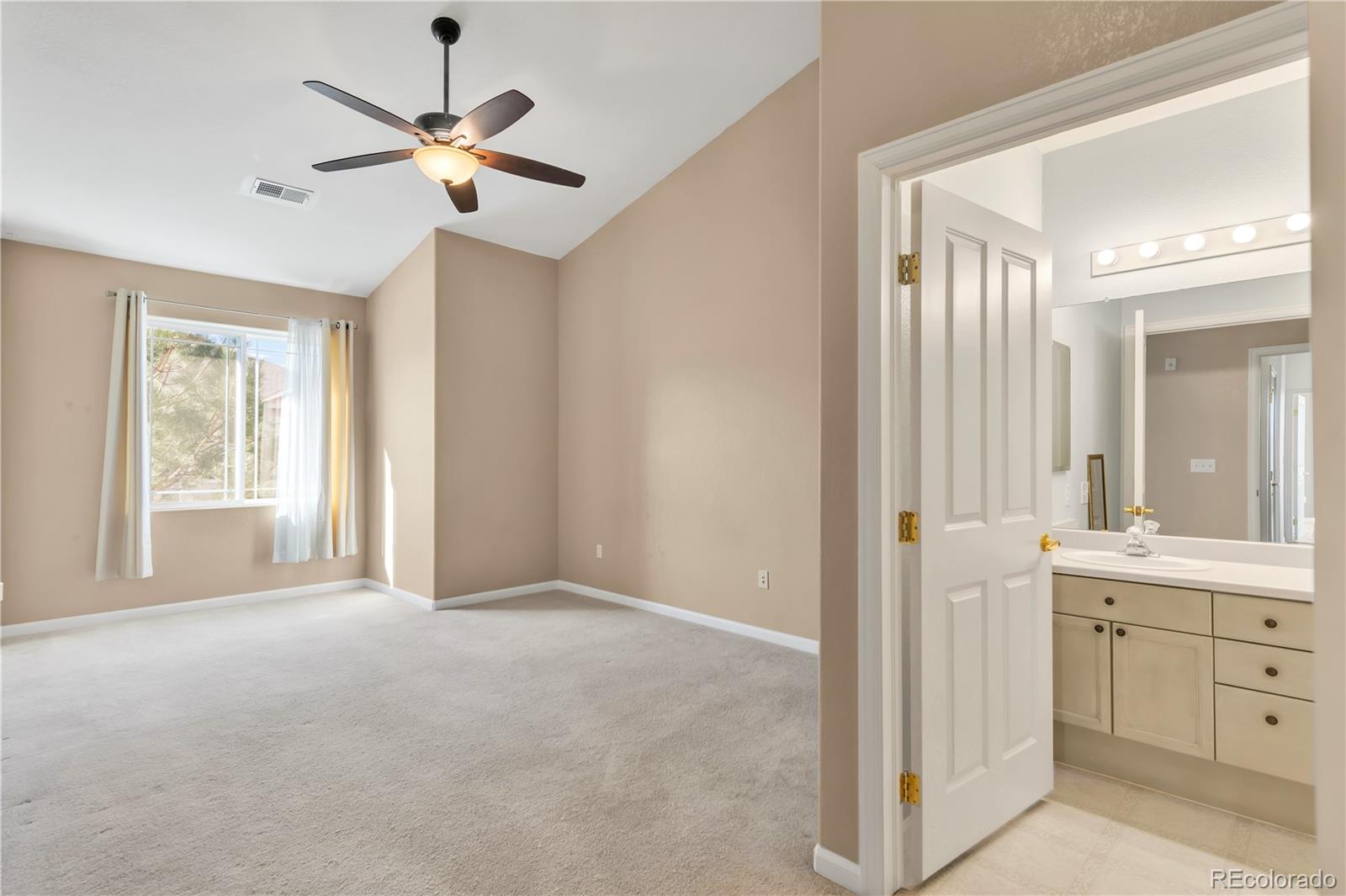 8456 South Hoyt Way, Unit 301 Littleton, CO 80128 - Photo 12 of 31 a view of a room with a window and a kitchen