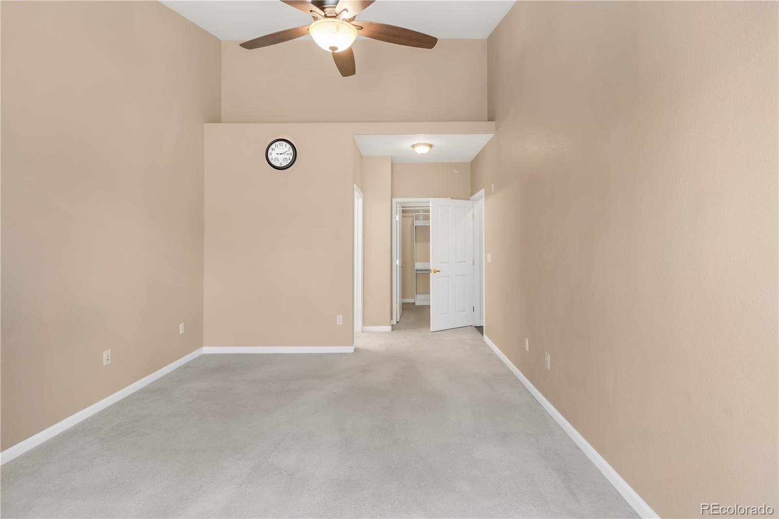 8456 South Hoyt Way, Unit 301 Littleton, CO 80128 - Photo 15 of 31 a view of an empty room with a chandelier fan