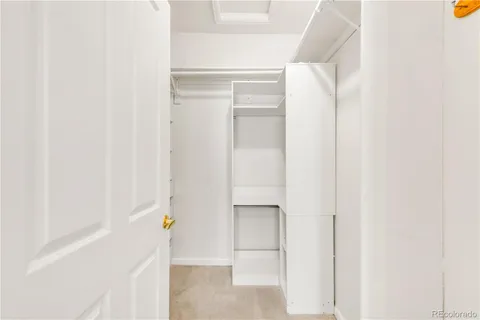 a close view of cabinet with two white walls