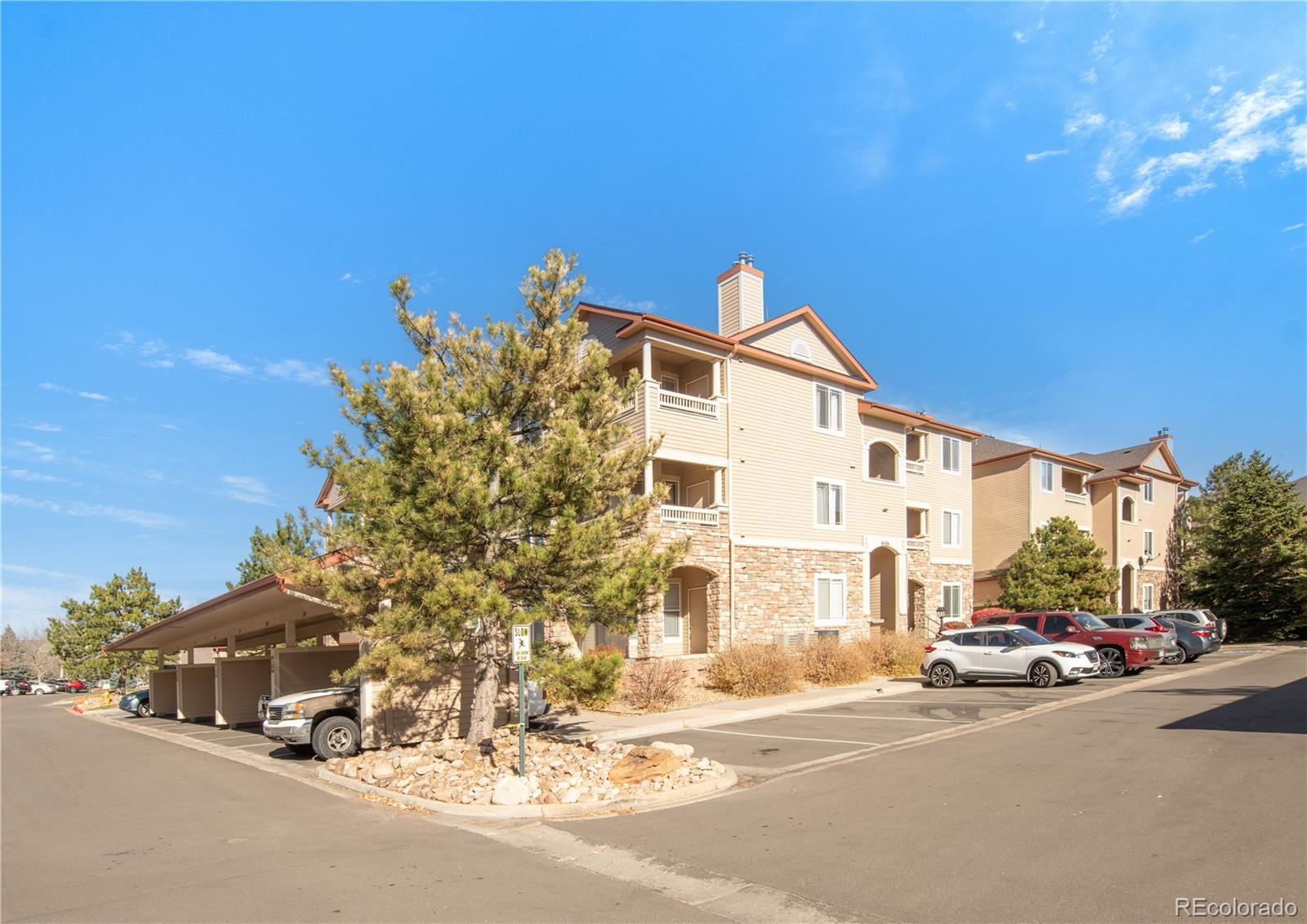 8456 South Hoyt Way, Unit 301 Littleton, CO 80128 - Photo 2 of 31 a view of a street with a building in the background