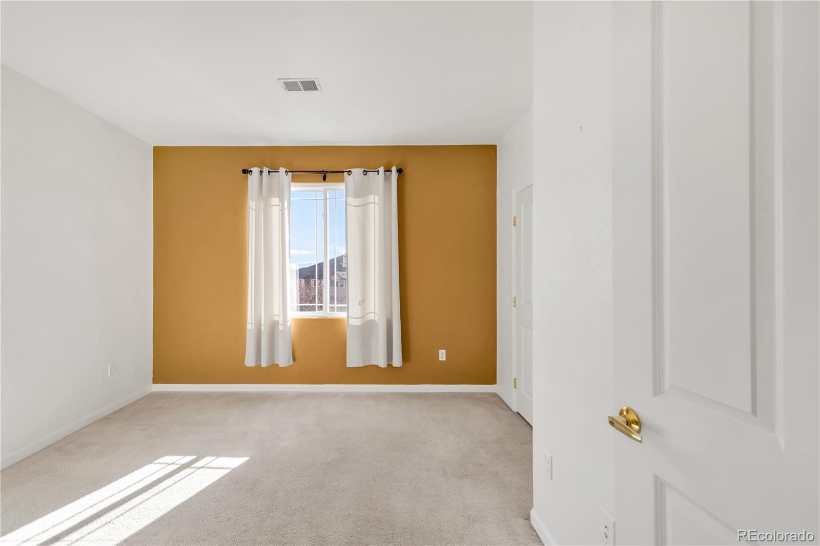 8456 South Hoyt Way, Unit 301 Littleton, CO 80128 - Photo 23 of 31 a view of an empty room with a window