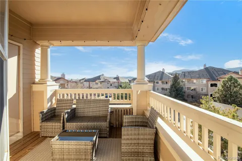 a view of a balcony with wooden floor