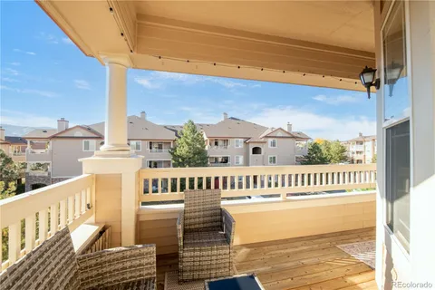 a view of a balcony with wooden floor
