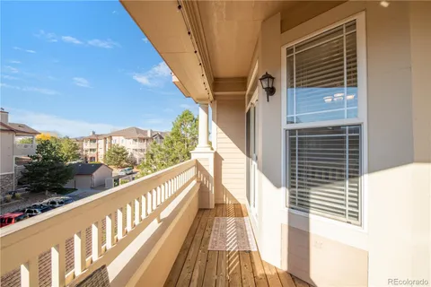 a view of balcony with wooden floor
