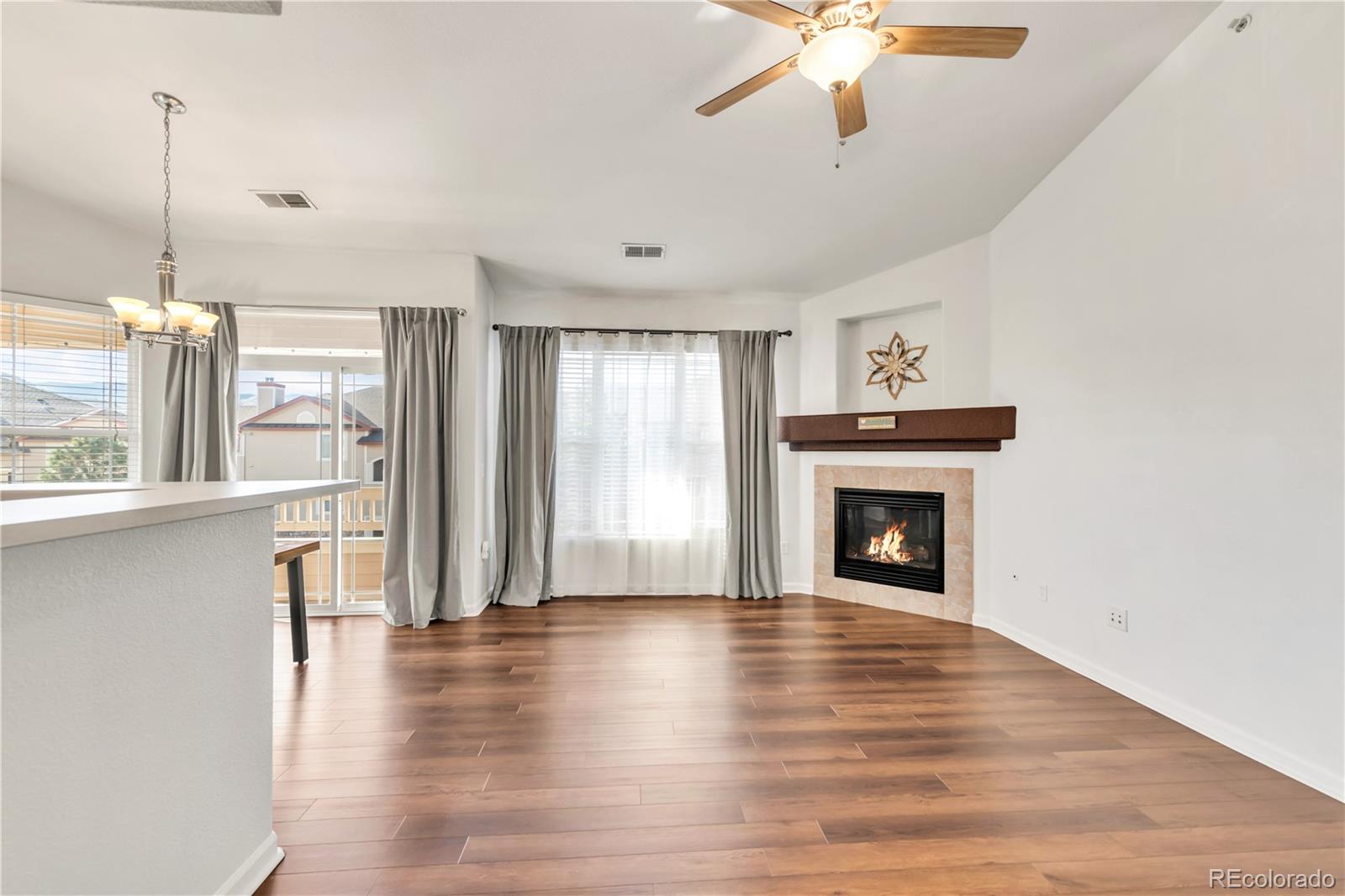 8456 South Hoyt Way, Unit 301 Littleton, CO 80128 - Photo 5 of 31 a view of empty room with wooden floor and fan