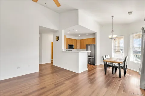 a view of a kitchen and dining room