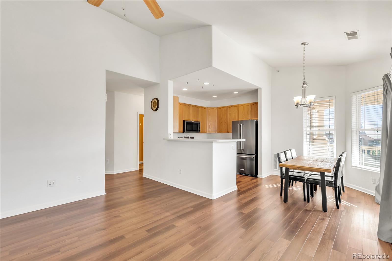 8456 South Hoyt Way, Unit 301 Littleton, CO 80128 - Photo 8 of 31 a view of a kitchen and dining room