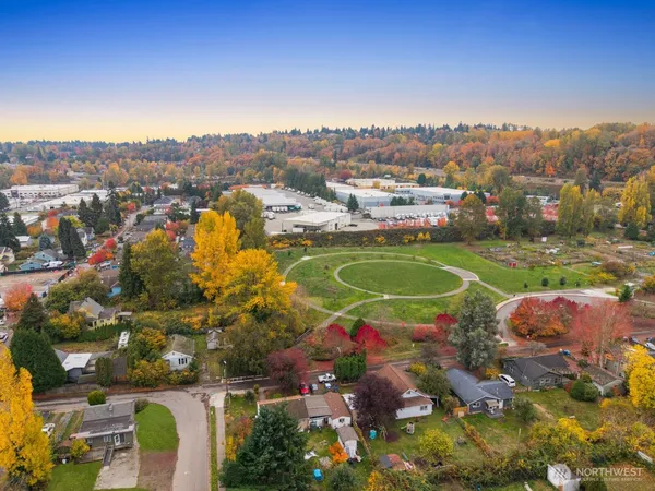 an aerial view of a houses with yard