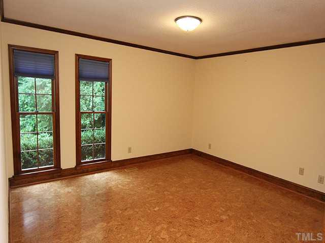 2215 Yorkgate Drive Raleigh, NC 27612 - Photo 16 of 24 This bedroom was used as an office/exercise room and features a cork floor. Bedroom