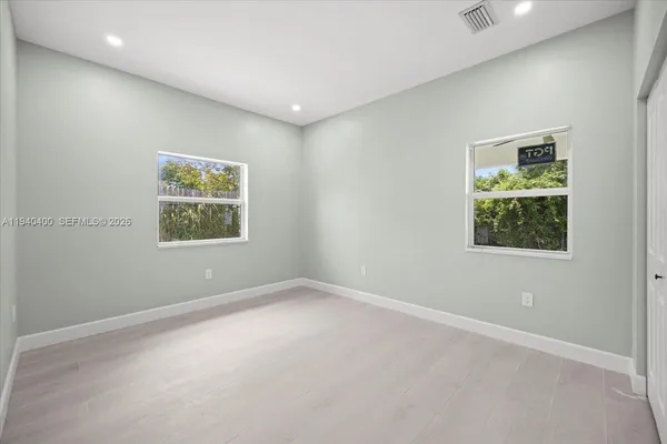 an empty room with windows