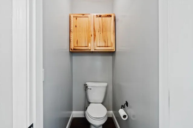 a bathroom with a toilet and a sink