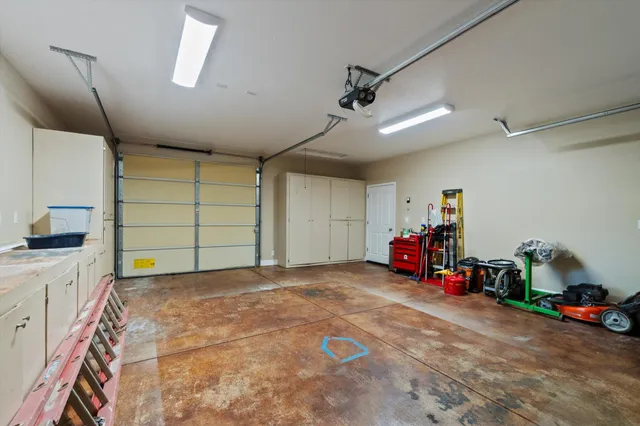 a view of a garage with storage and utility