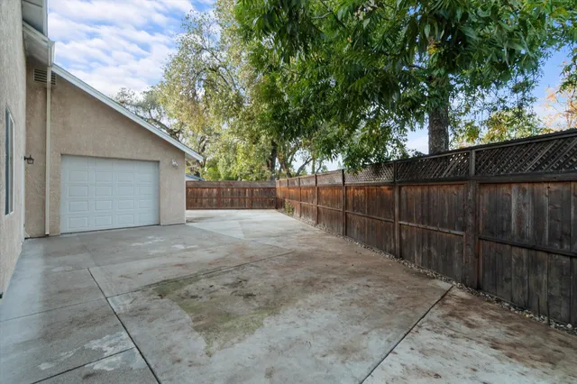 a backyard of a house with lots of green space